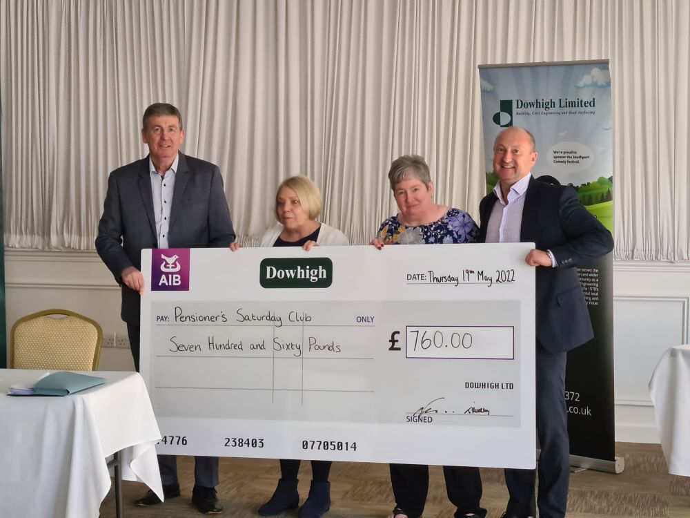 Saturday Pensioner Club representatives accepting their donation from directors Michael and Trevor Murray at the Dow Foundation awards
